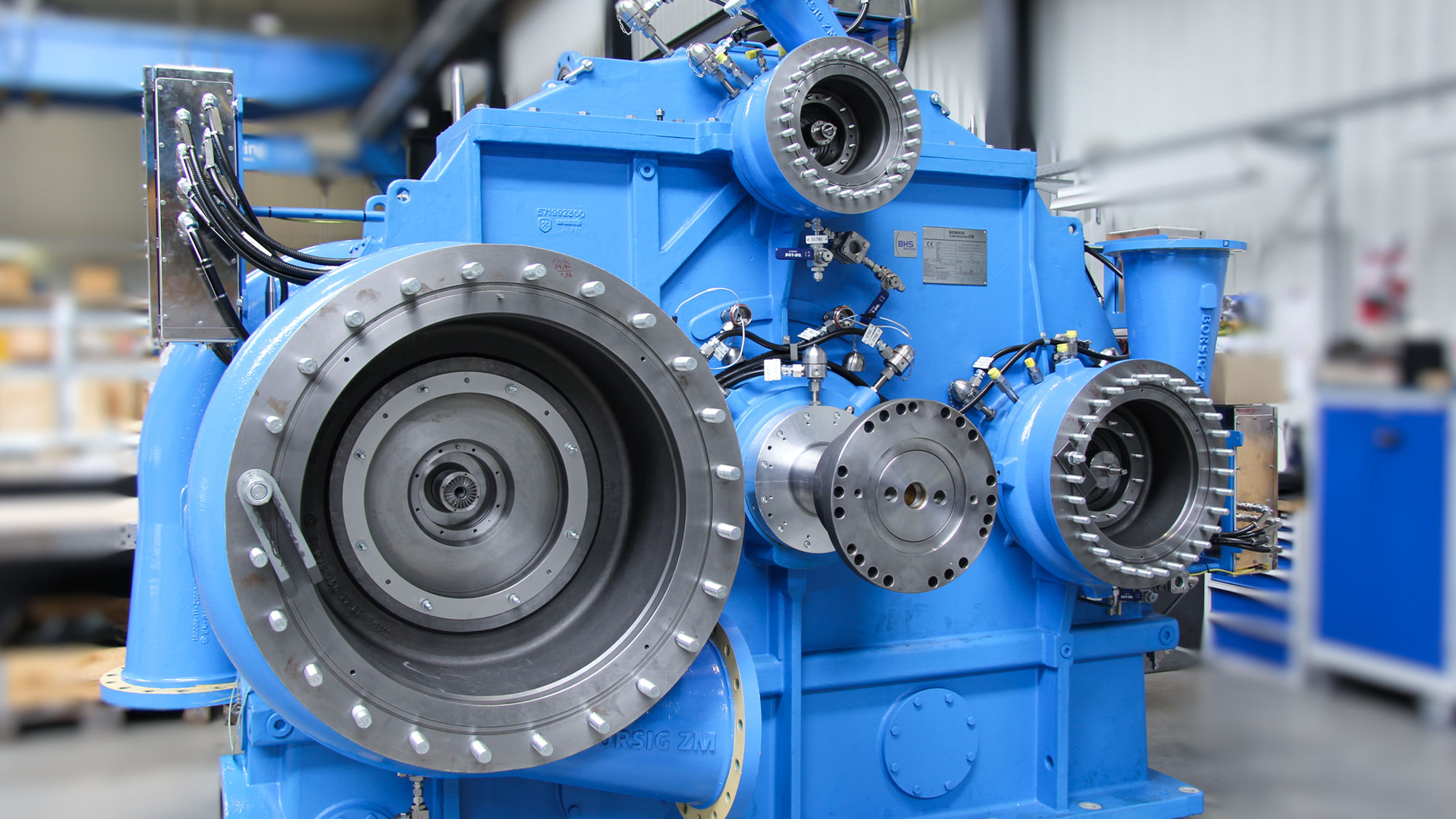 Shown is a blue integrally geared centrifugal compressor during assembly at BZM before installation of the impellers.